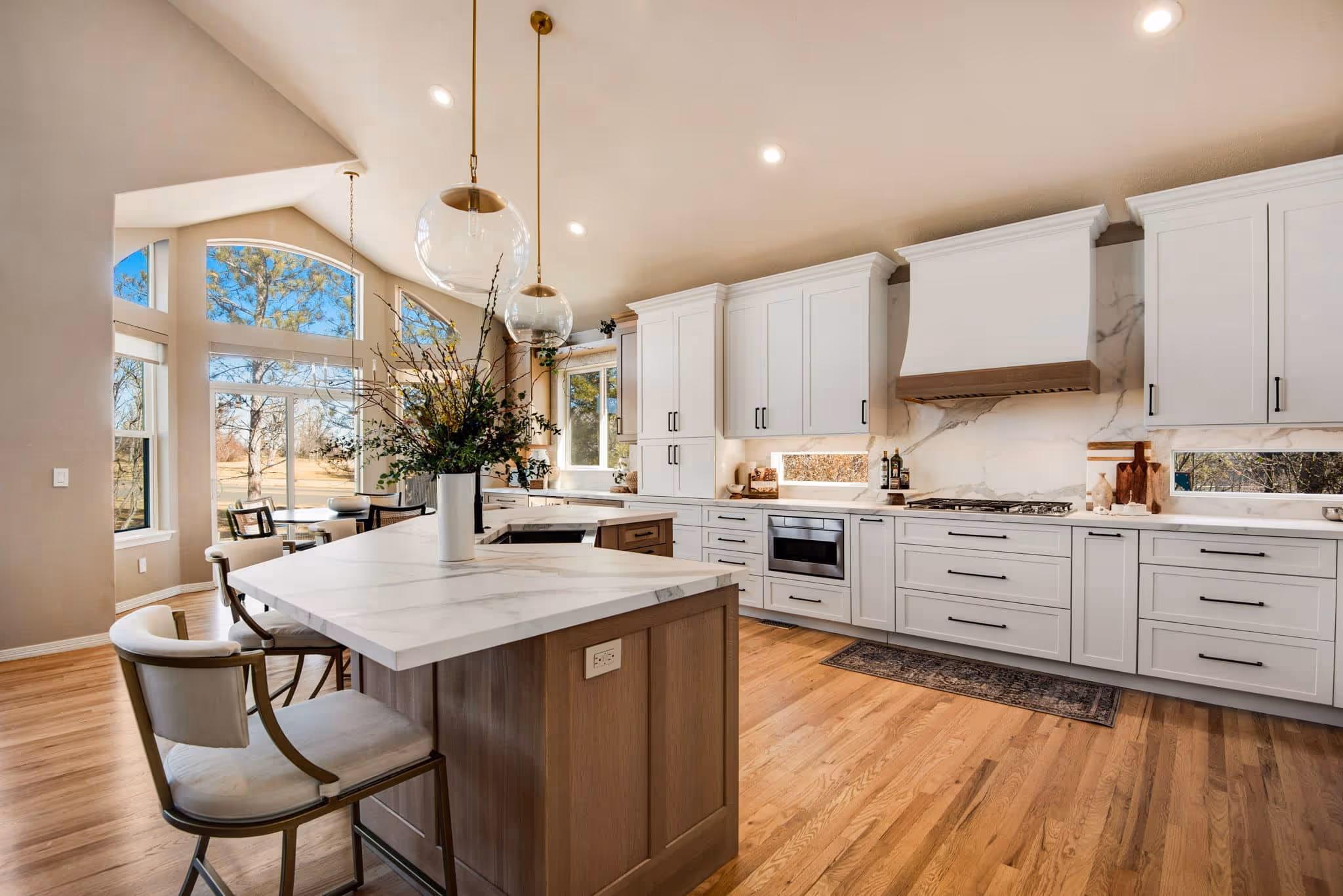 Spacious entryway or mudroom with built-in storage benches and organizational cubbies.