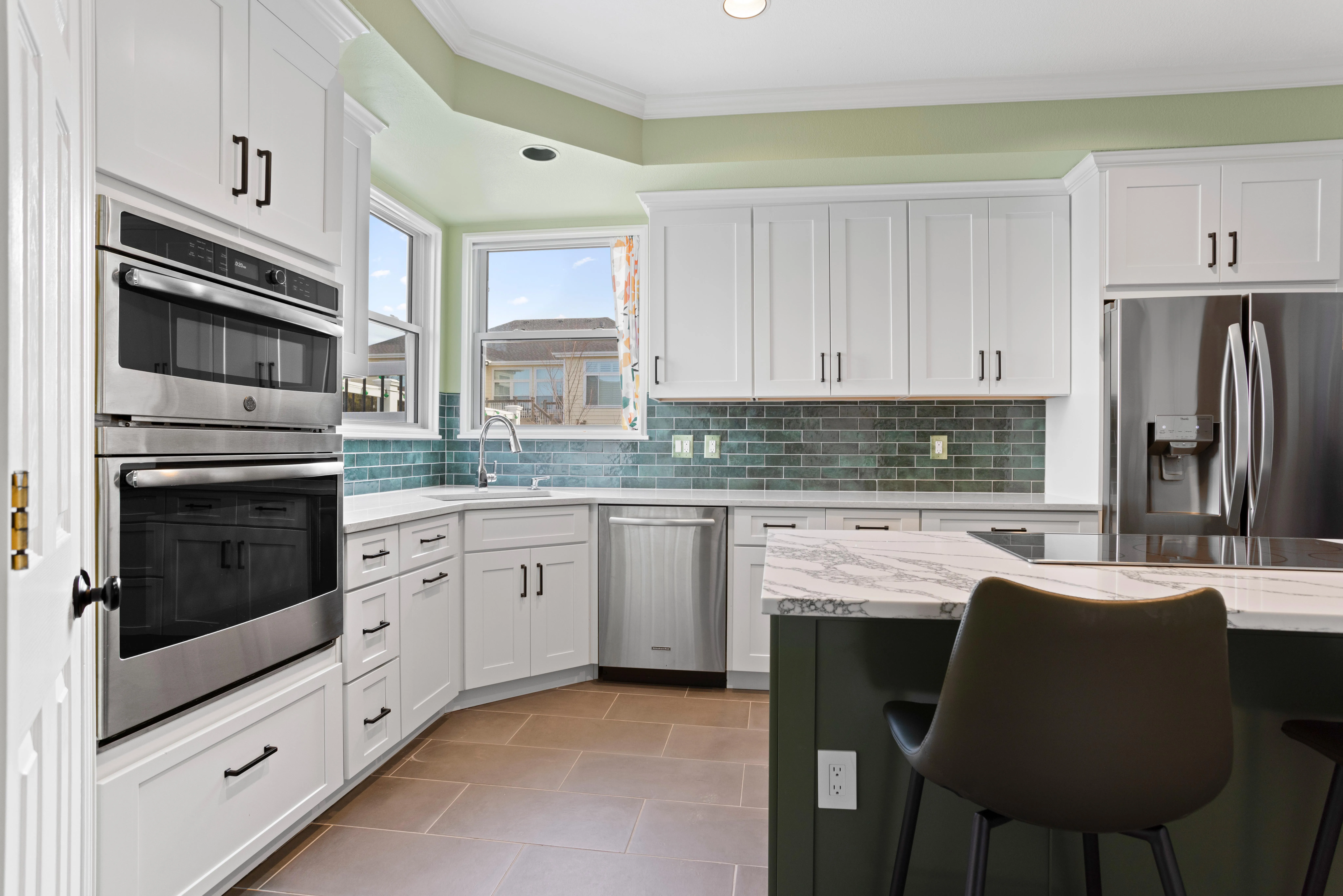 Close-up of a beautifully crafted kitchen island with pendant lights and seating.