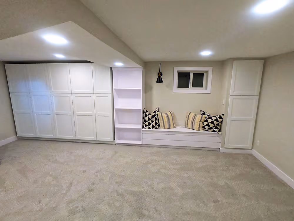 Basement entertainment area with a media center and comfortable seating.
