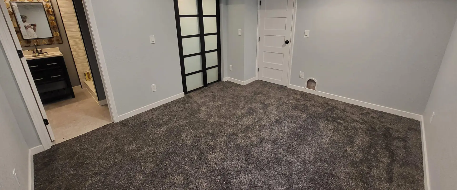 Before and after comparison of a basement finishing and transformation project.