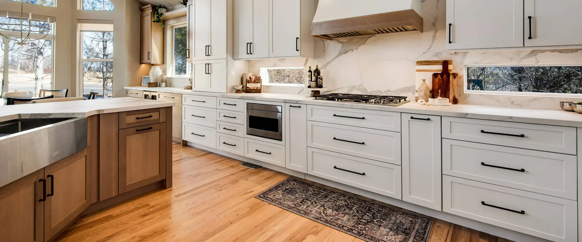 Before and after photo of a complete kitchen renovation and remodel.