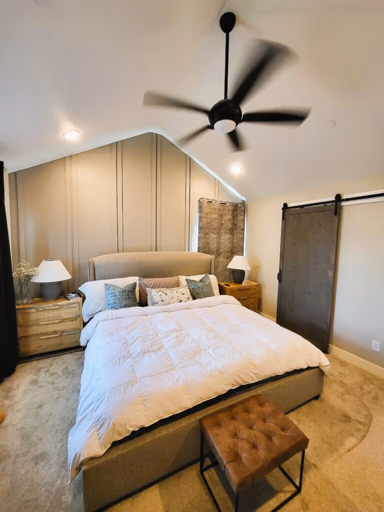Modern barn door on a sliding track in an interior hallway or room.